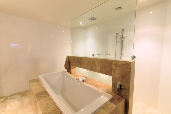 Bathroom renovation Tweed Heads with central bath and shower behind