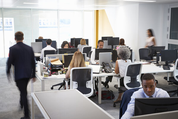 Commercial fit out - example of an office fit out - man walking through busy office.